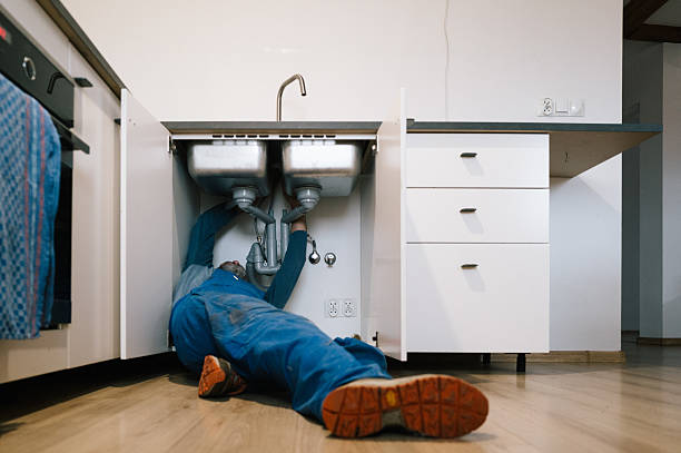 Professional Drain Cleaning technician working in Milford, NH